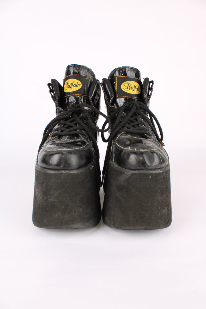 Buffalo Tower black patent leather platform lace up trainers, featuring buffalo branding on the back of the heel
