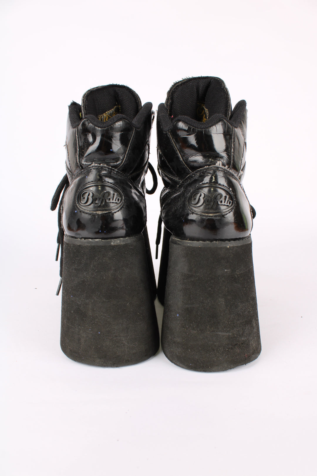 Buffalo Tower black patent leather platform lace up trainers, featuring buffalo branding on the back of the heel