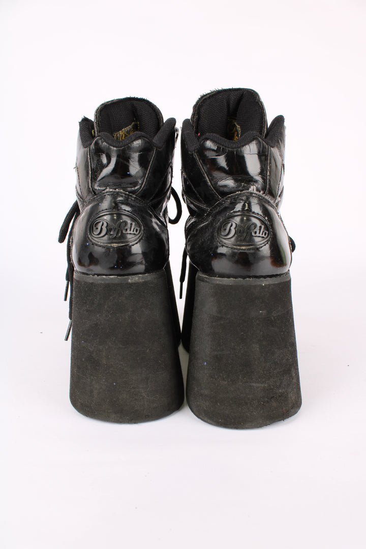 Buffalo Tower black patent leather platform lace up trainers, featuring buffalo branding on the back of the heel