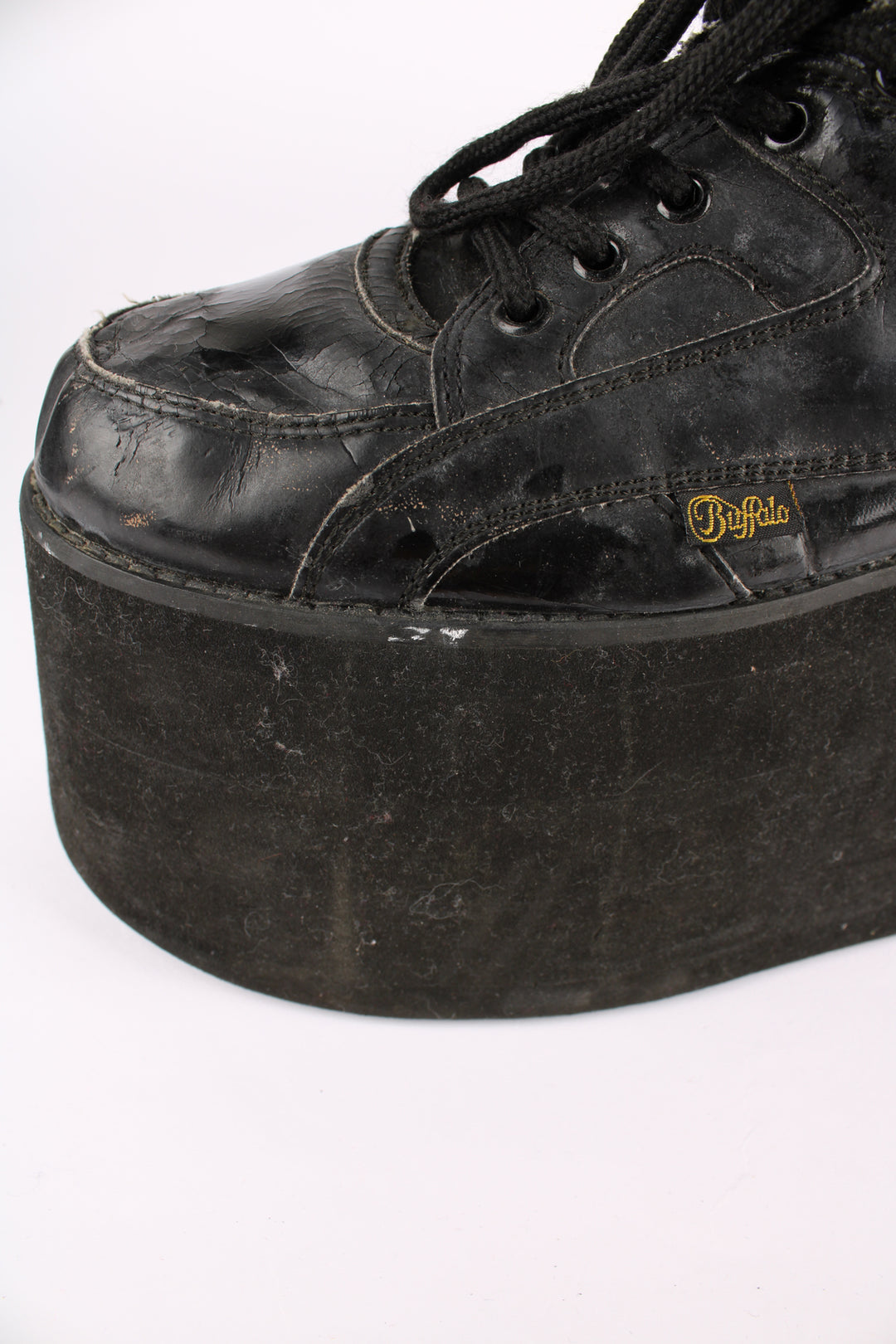 Buffalo Tower black patent leather platform lace up trainers, featuring buffalo branding on the back of the heel