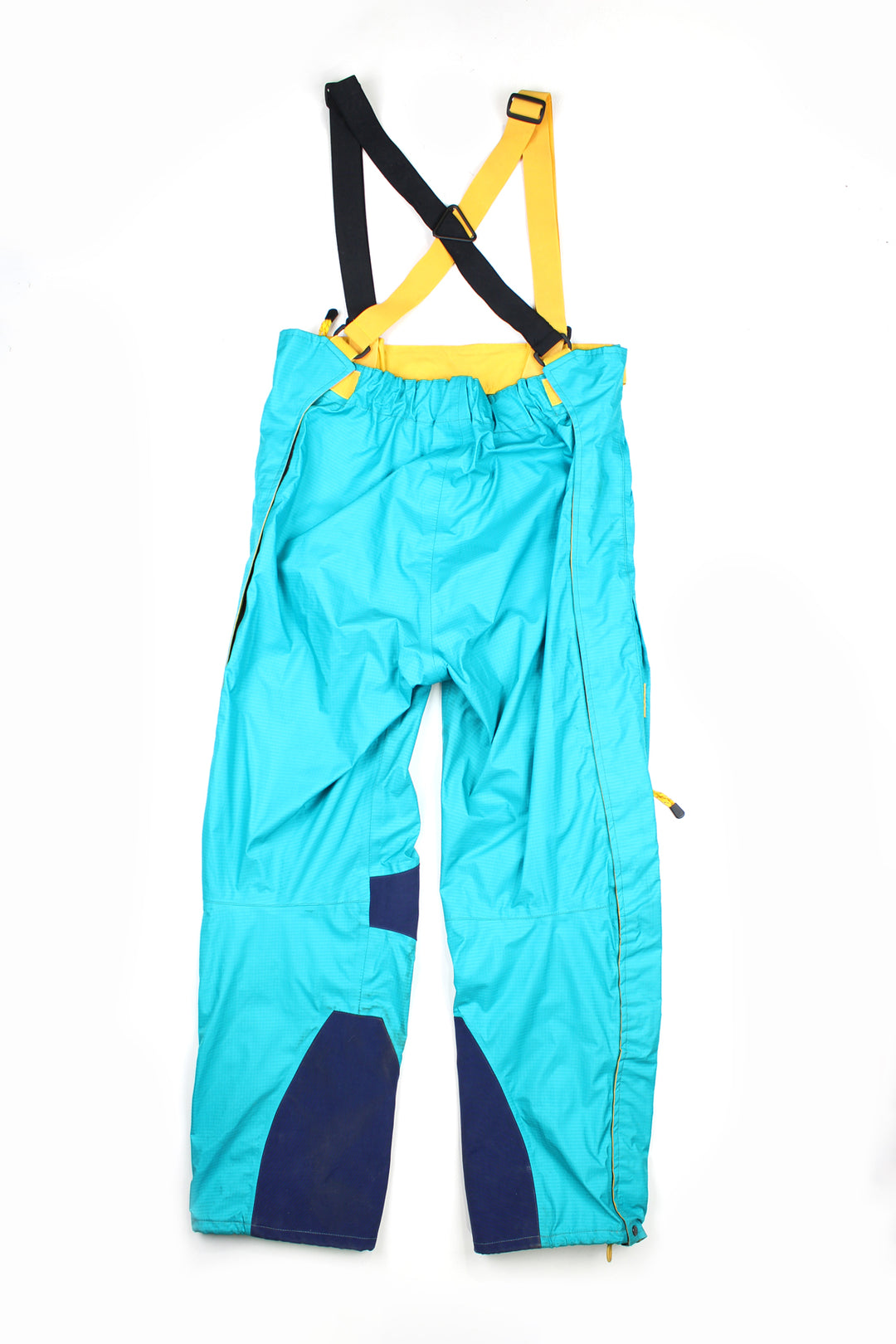 Vintage blue Berghaus Ski Salopettes. Slightly padded, elasticated waistband and adjustable shoulder straps. Closes with a zips and velcro at either side of the waistband.   good condition   Size in Label:  Womens size 16