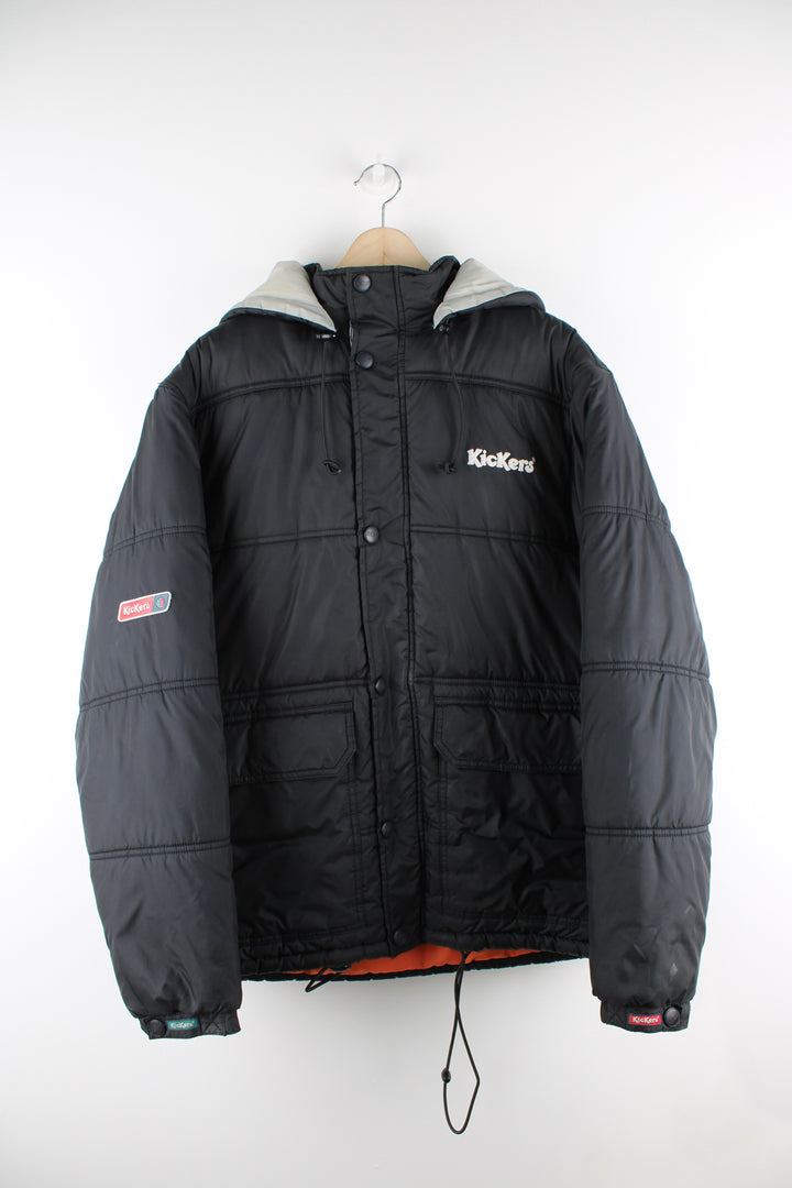 Vintage Kickers puffer jacket in black, zip up, insulated, multiple pockets, hooded and has the logo embroidered on the front.
