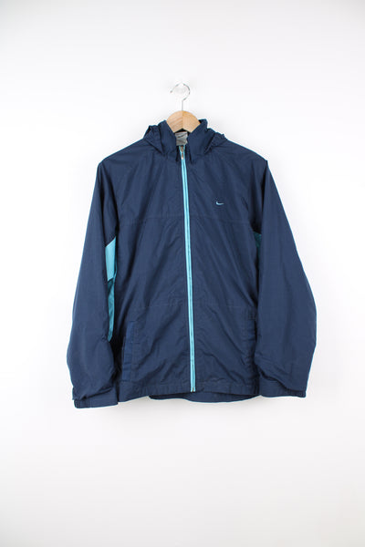 Nike Lightweight Jacket in a blue colourway, zip up, side pockets, hidden hood, and has the swoosh logo embroidered on the front.
