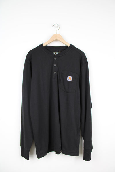 Vintage Carhartt relaxed fit all black button up sweatshirt with logo on the chest pocket