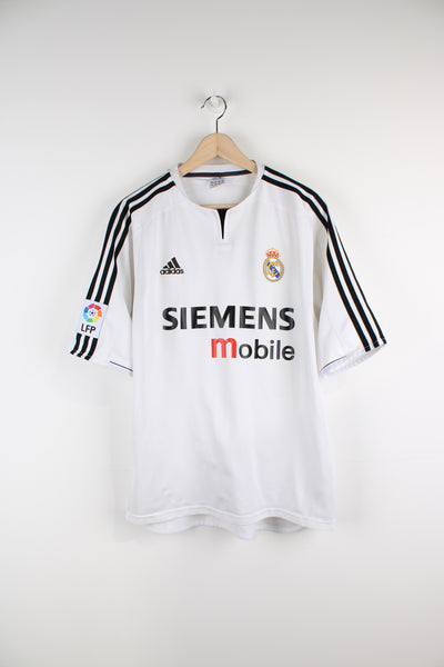Vintage Real Madrid 2003/04, Adidas Home Football Shirt, white and black team colourway, and has logos embroidered on the front. 