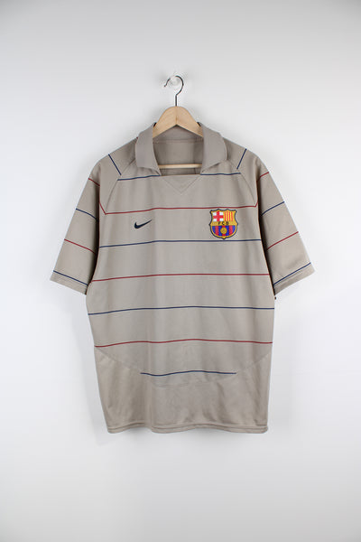 Vintage Barcelona 2003/04, Nike Away Football Shirt, brown colourway with red and blue stipes throughout, and has logos embroidered on the front. 