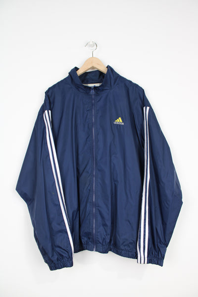 90's Adidas navy blue nylon tracksuit top with embroidered logo on the chest and three stripe down the sleeve