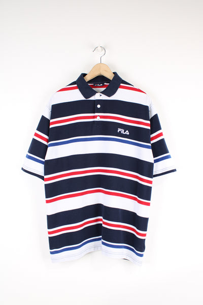 Vintage Fila Polo Shirt, blue, red and white striped colourway, button up, short sleeves, and has logo embroidered on the chest. 