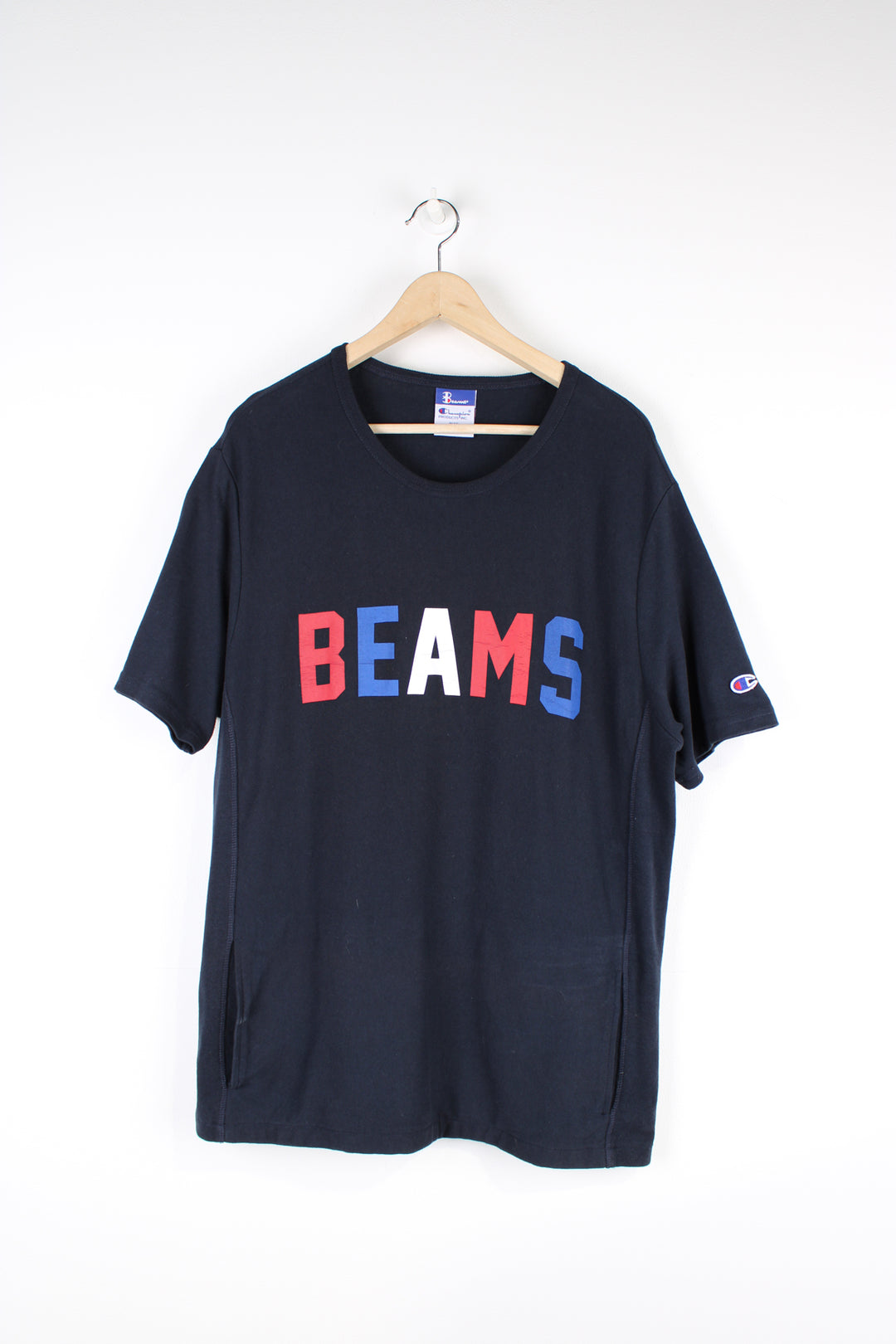 Beams x Champion T-shirt, blue, red and white colourway, short sleeves, big neck lining, has a big front pocket, as well as big spell-out logo across the chest.