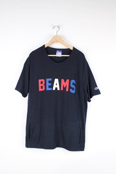 Beams x Champion T-shirt, blue, red and white colourway, short sleeves, big neck lining, has a big front pocket, as well as big spell-out logo across the chest. 