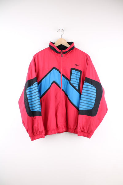 Vintage 90's Head Sportswear Shell Jacket in a red, blue and black patterned colourway, zip up, side pockets, and has the logo embroidered on the front.