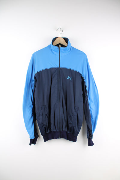 Puma Tracksuit Jacket in a blue colourway, zip up, side pockets, and has the logo embroidered on the front.