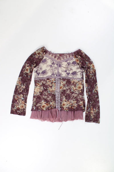 Y2K purple lacy mesh top features embroidered details, ruffled hem and sleeves.