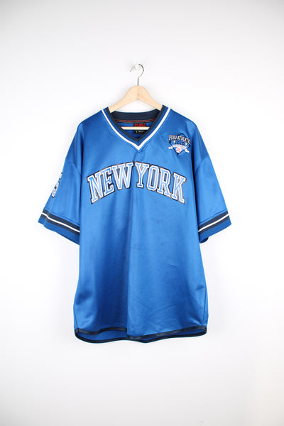 Vintage Y2K Fubu City Series Collection, New York baseball jersey in a blue and black colour way, v neck with embroidered logos and Fubu number 5 on the back. 