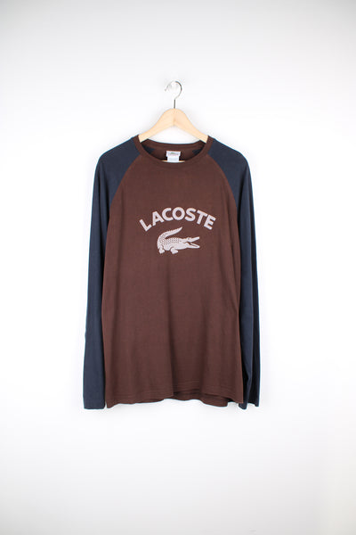 Lacoste navy and brown long sleeve t-shirt, features spell-out logo across the chest