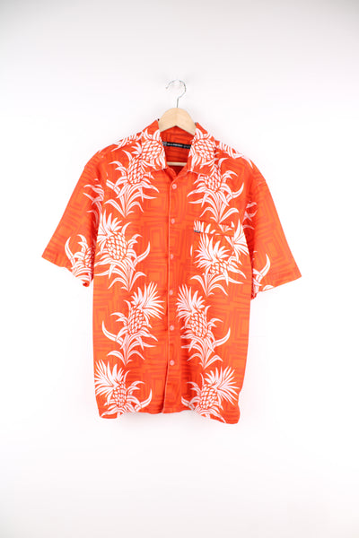 Billabong Hawaiian Shirt in a orange and white colourway, floral pattern design printed all over, button up and has a chest pocket.