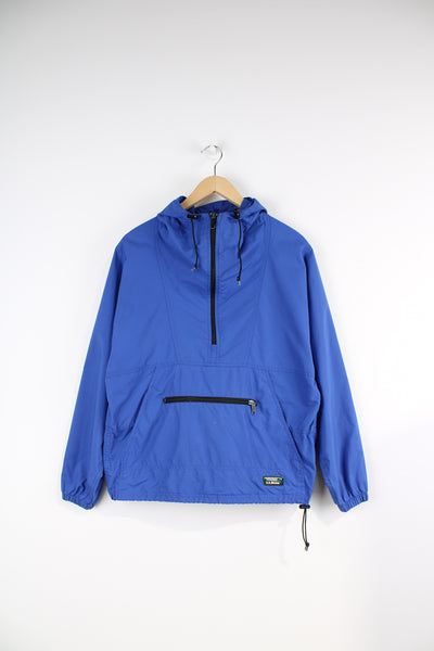 Vintage L.L.Bean pullover jacket in a blue colourway, half zip, has two big kangaroo pockets, and logo embroidered on the bottom. 