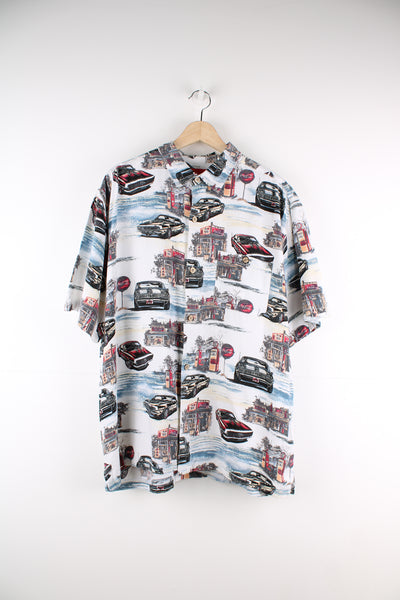 Coca Cola Hawaiian Shirt in a white colourway with cars and petrol station design printed all over, button up and has a chest pocket.