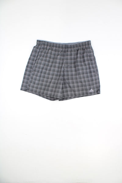 Adidas Plaid Shorts in a grey colourway, adjustable waist, netted lining, pockets and has the logo embroidered on the front.