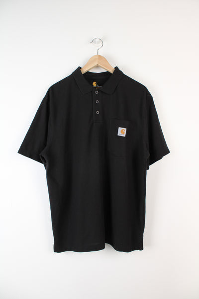 All black Carhartt original fit polo shirt with embroidered logo on the chest pocket