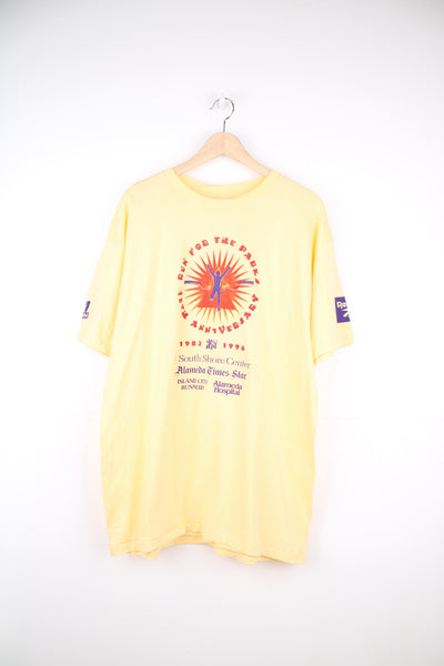 Vintage 1996 'Run for the Parks 15th Anniversary' graphic t-shirt in yellow with printed spell-out details and sponsors