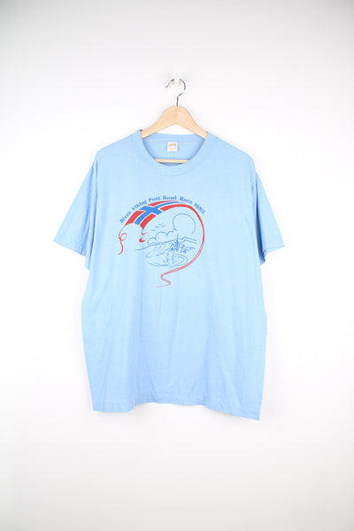 Vintage 1983 made in the USA baby blue single stitch t-shirt with printed graphic on the front 