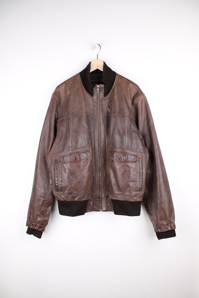 Vintage CAT brown, leather bomber jacket. Features elasticated cuffs/ waistband and closes with a full zip.  Good condition - Some scuffs and scratches to the leather (see photos) Size in Label  Mens XL