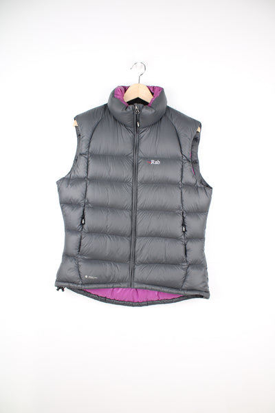 Rab Gilet in a grey and purple colourway, zip up, side pockets, insulated lining, and has the logo embroidered on the front.
