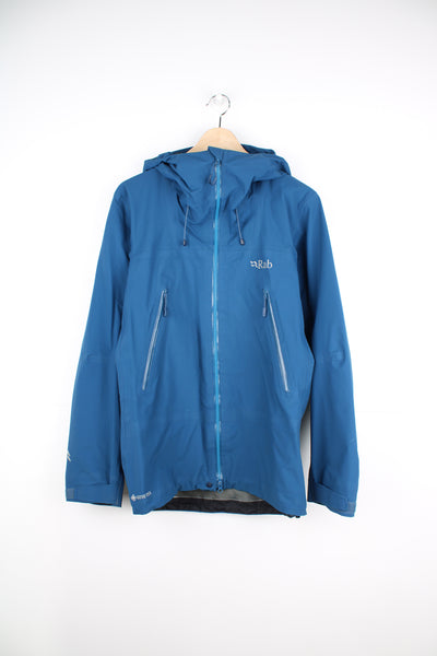Rab Kangri GTX Jacket in a blue colourway, zip up, side pockets, hooded, and has the logo printed on the front.