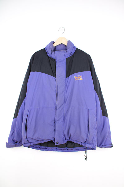 Mountain Equipment Jacket in a purple and black colourway, zip up, side pockets, and has the logo embroidered on the front.