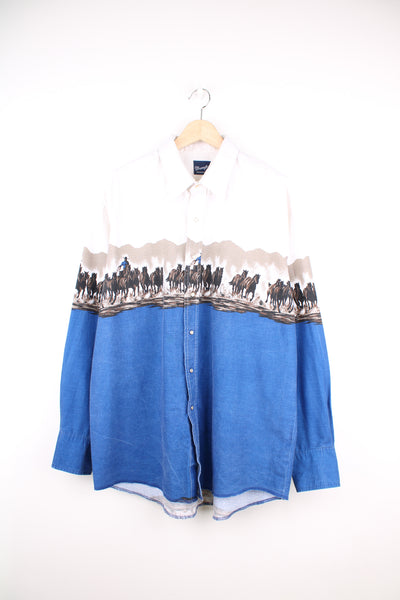 Vintage Wrangler western shirt, features all over graphic of cowboys herding cattle and western style yoke and pearl snap buttons 