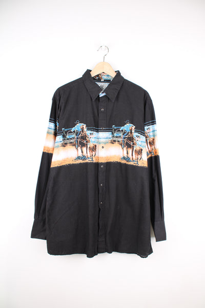 Vintage Corral West western shirt, features all over graphic of cowboys herding cattle , a western style yoke and snap buttons 