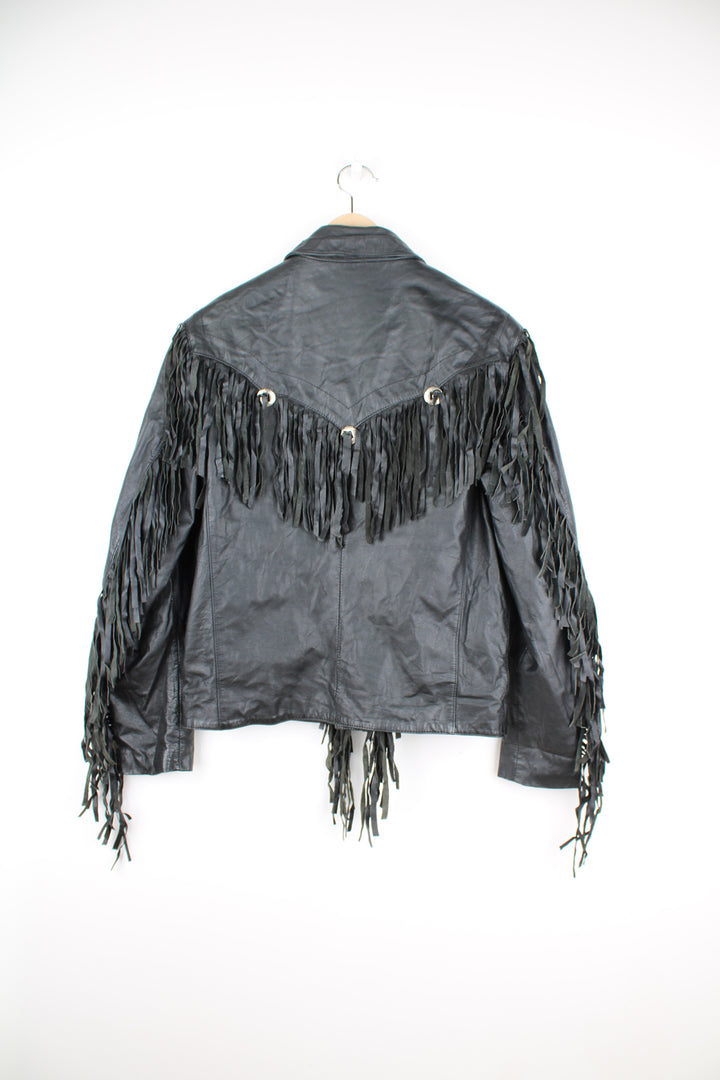 Vintage Wilson's black zip through leather jacket with fringe details on the back of the shoulders and silver conch buttons