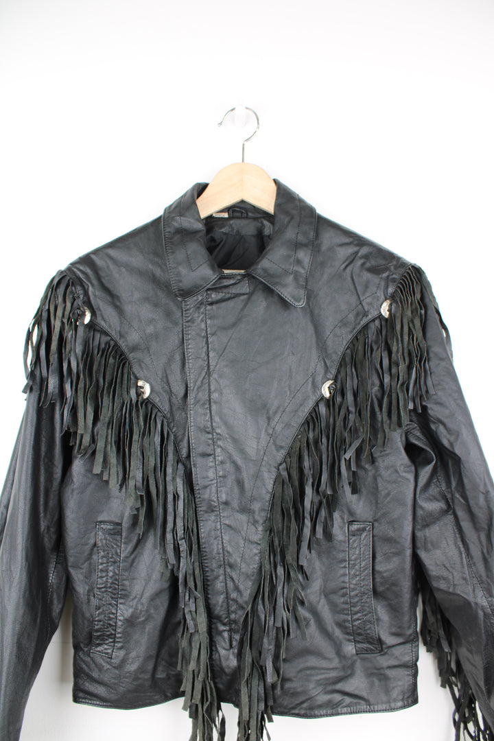 Vintage Wilson's black zip through leather jacket with fringe details on the back of the shoulders and silver conch buttons