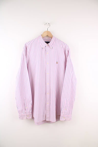 Ralph Lauren Shirt in a pink, blue and white striped colourway, button up, and has the logo embroidered on the front.