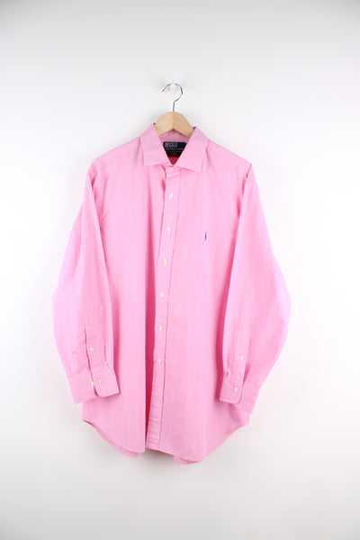 Ralph Lauren Shirt in a pink colourway, regent custom fit, button up, and has the logo embroidered on the front.