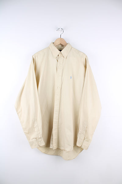 Ralph Lauren Shirt in a yellow colourway, button up and has the logo embroidered on the front.