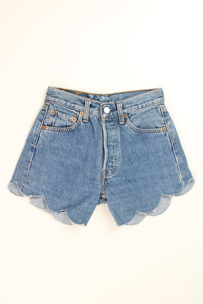 Vintage Levi's 501 blue denim shorts with scalloped edges