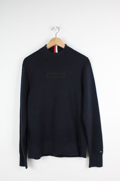 Tommy Hilfiger navy blue high neck knit jumper with embroidered logo on the chest