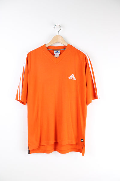 Vintage 90's Adidas v neck orange t-shirt with embroidered  logo on the chest.