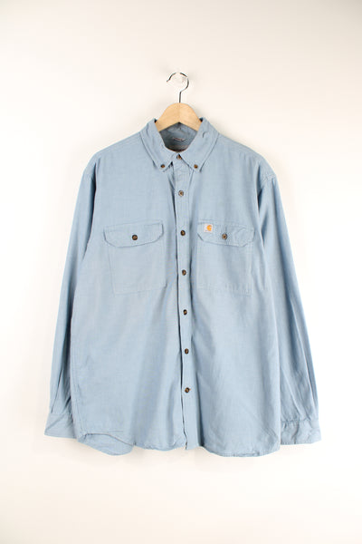 Vintage Carhartt button up shirt with long sleeves and branded logo on the chest pockets.