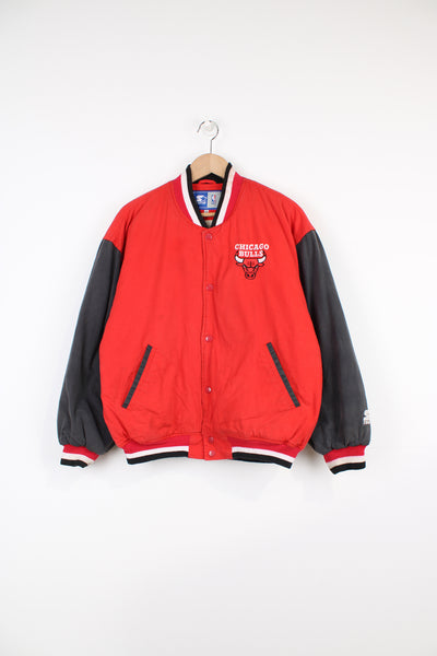 Chicago Bulls NBA, Starter Varsity Jacket in the red, black and white team colourway, cotton material with a polyester lining, button up, and has logos embroidered on the front and back.