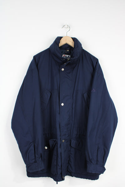 Fila, navy blue sports coat with multiple pockets, foldaway hood and embroidered logo on the sleeve