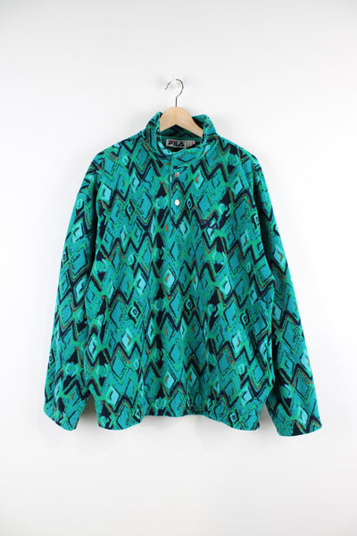 Vintage green/blue geometric print Fila 1/4 zip fleece features embroidered logo on the chest