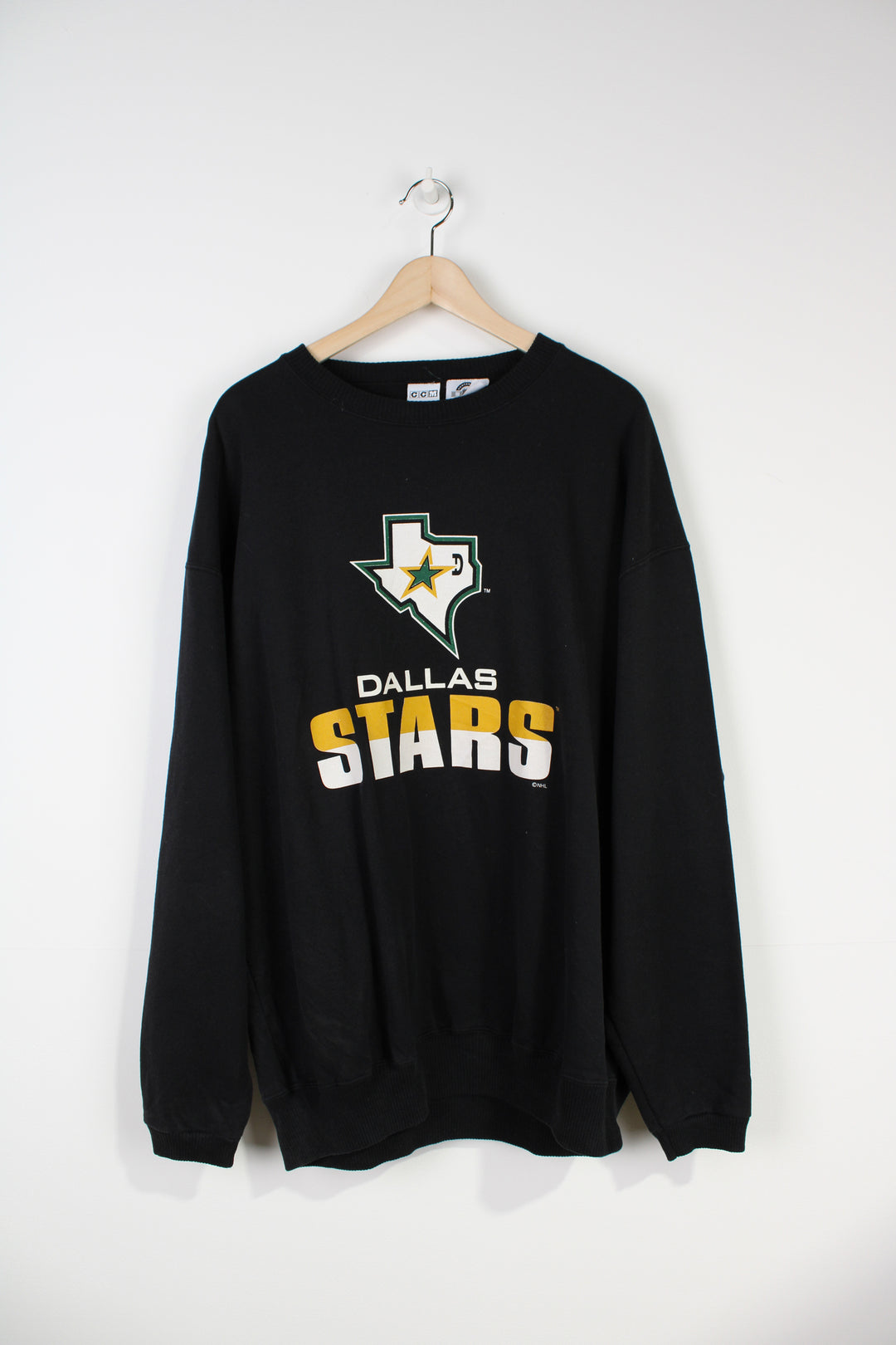 Dallas Stars black sweatshirt by CCM with printed spell-out graphic on the front