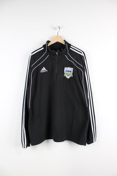 Seattle United 1/4 zip pullover fleece by Adidas features embroidered spell-out across the chest