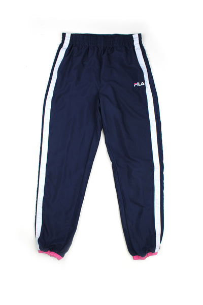 Vintage 00's Fila blue tracksuit bottoms with white stripes down the side and embroidered logo, also has a elasticated waist and pink cuffs at the bottom. 