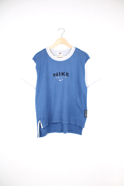Nike T-Shirt in a blue and white colourway, and has the logo spell out embroidered across the chest.