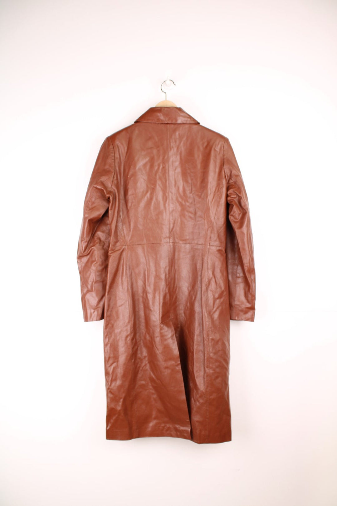 Paragon red-brown leather trench coat with two side slit pockets and concealed button closure.