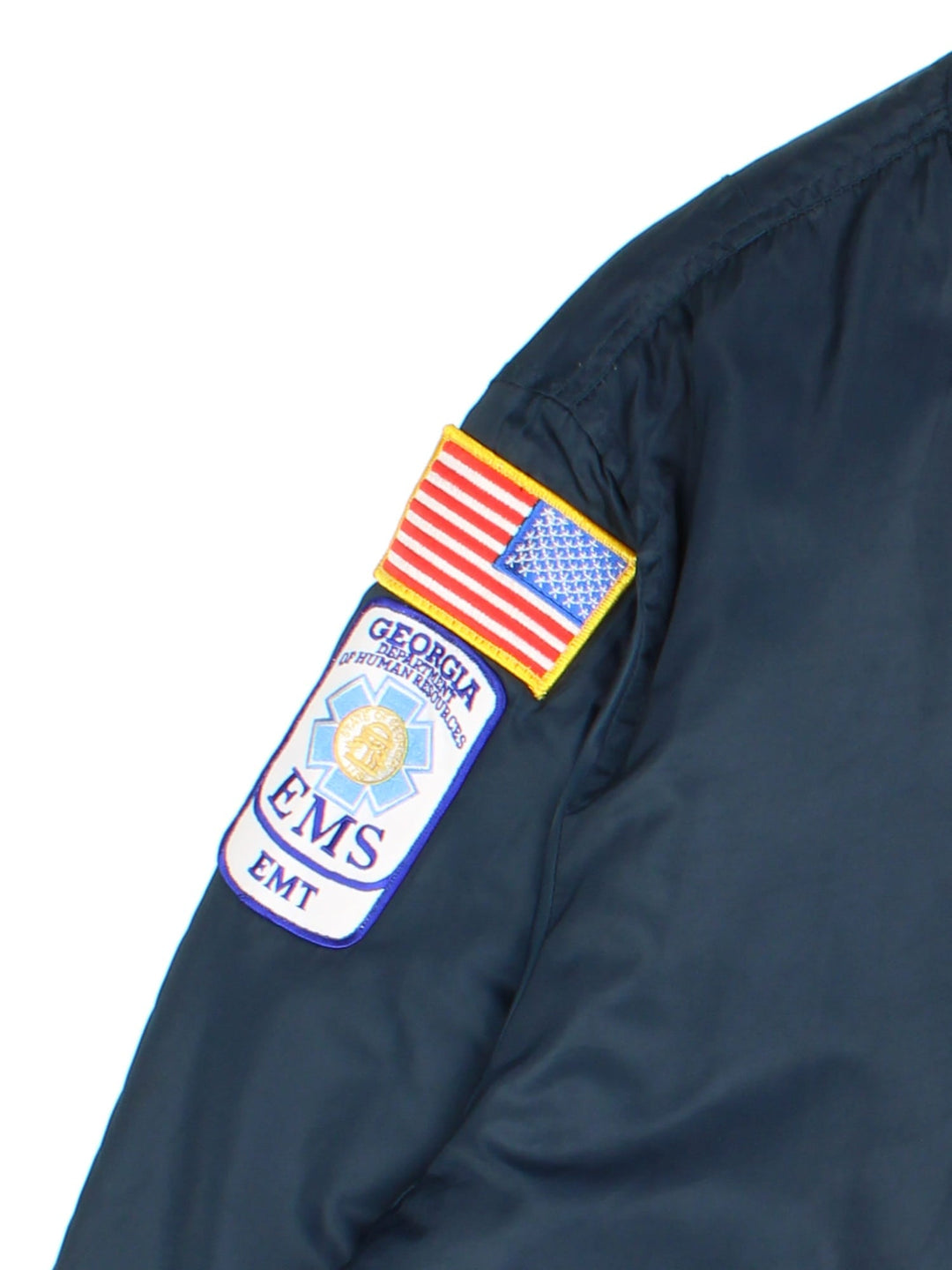 Vintage College Park Fire Department MA1 Reversible Bomber Jacket in either a blue or orange colourway options. Zips up and has side pockets, insulated, and has badge logos embroidered on the front and sleeves.